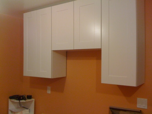 Cupboards with doors on the sink side of the kitchen